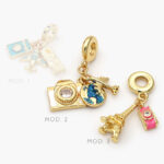 Colgante Viajes Chapa de Oro 25