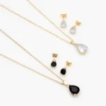 Juego Gota Zirconias Blancas y Negras Chapa de Oro 169